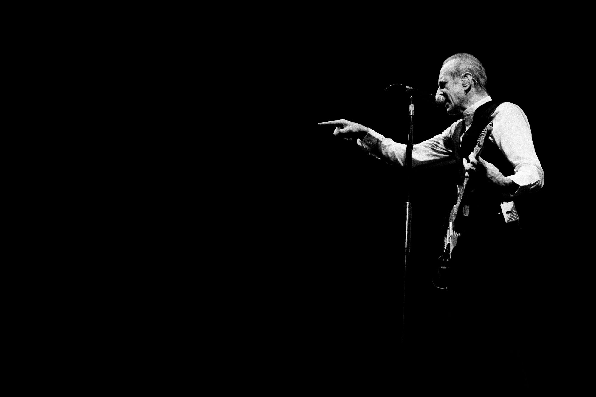 Black and white Photo of lead singer from Status Quo performing live in Olomouc Czech republic